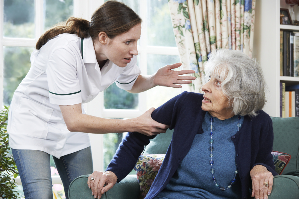 Why You Should Hire A Nursing Home Abuse Lawyer - Care Worker Mistreating Senior Woman At Home
